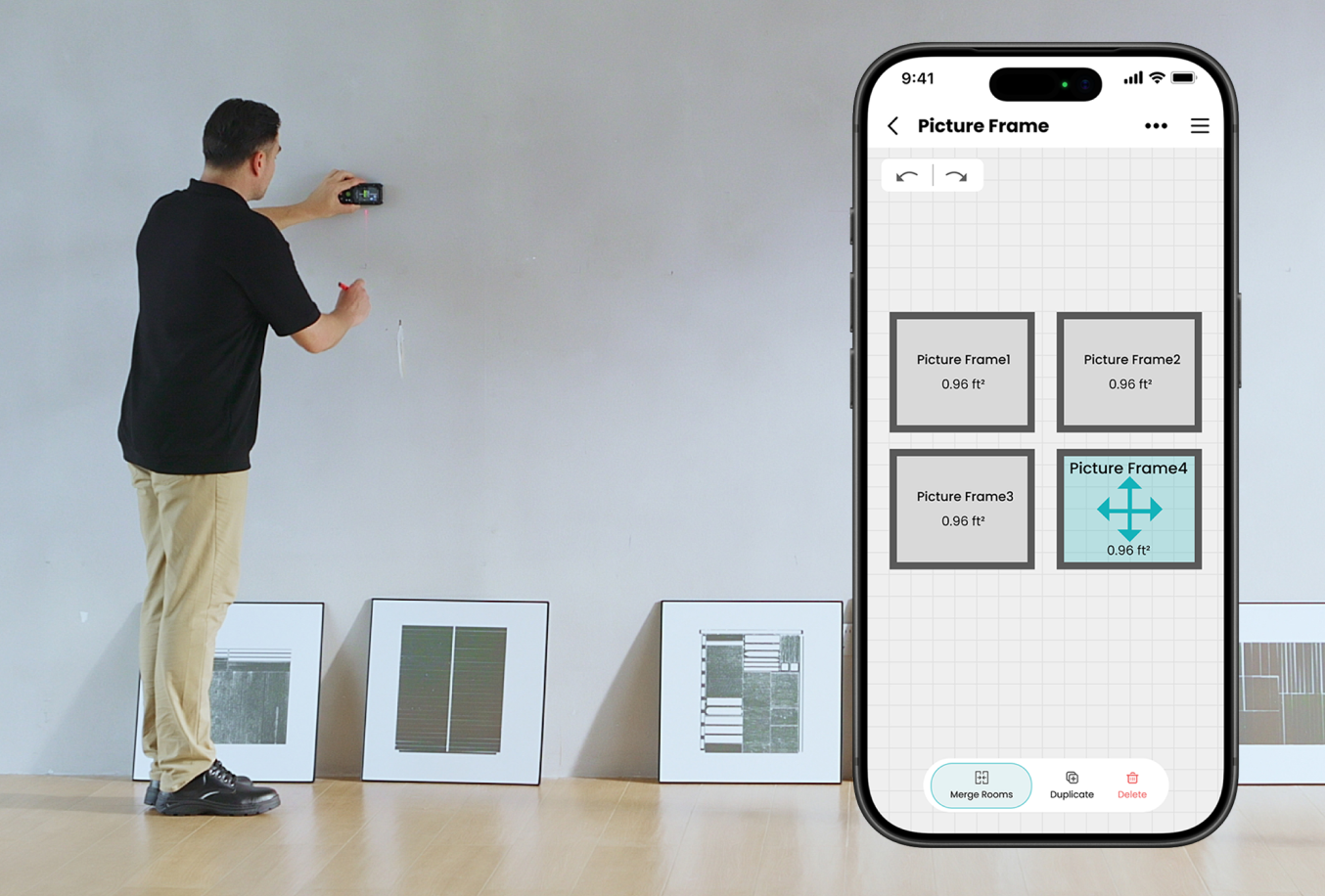 DIYer measuring a wall for picture frames with a laser distance measure and smartphone app