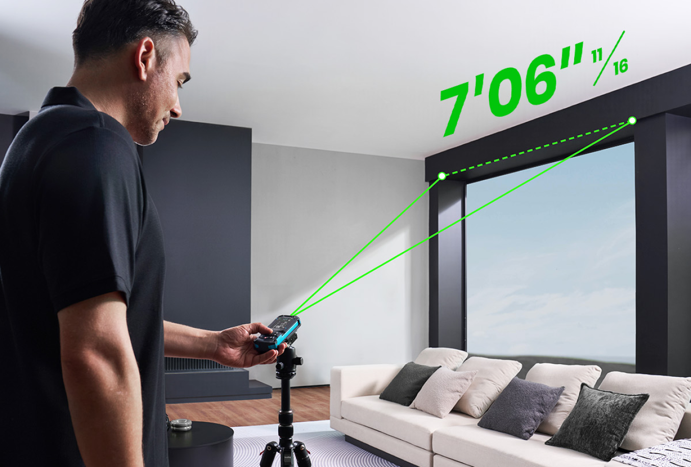 DIYer measuring a window opening with a tripod-mounted MILESEEY laser distance measure