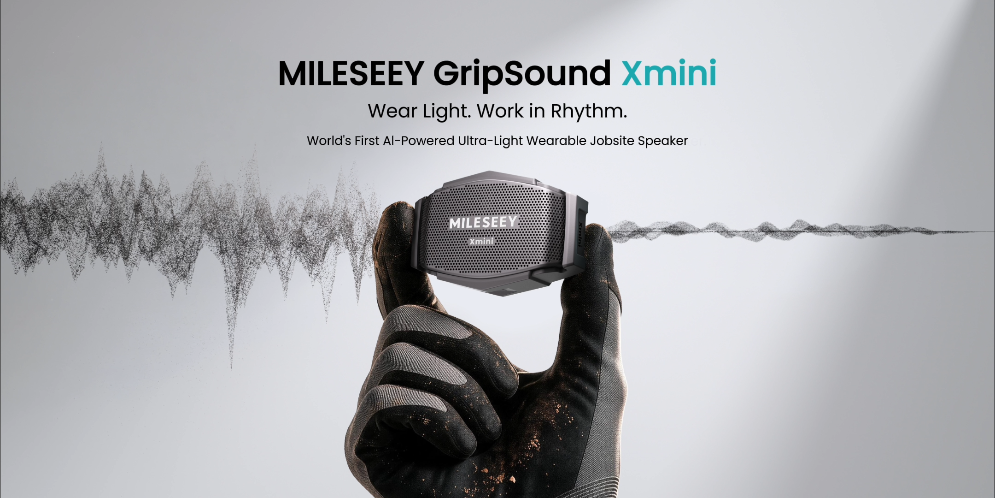 Gloved hand holding the Mileseey GripSound Xmini wearable speaker against a sound-wave backdrop