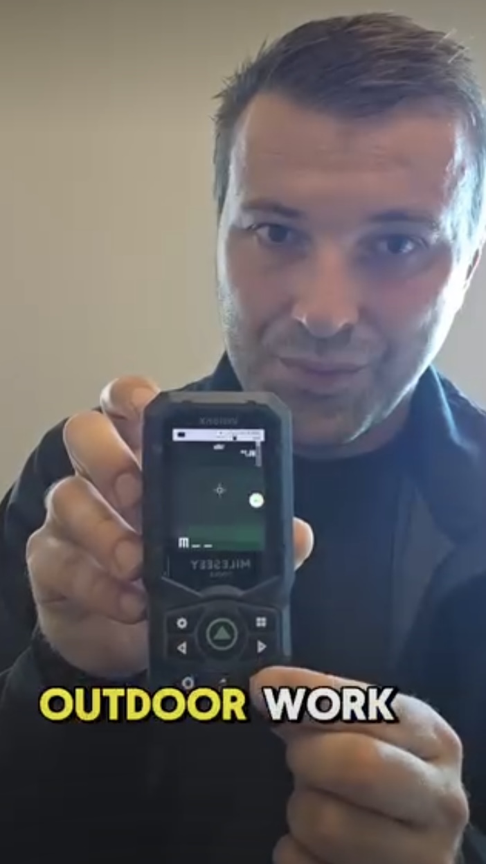 Creator demonstrating MILESEEY S50C outdoor measurement features