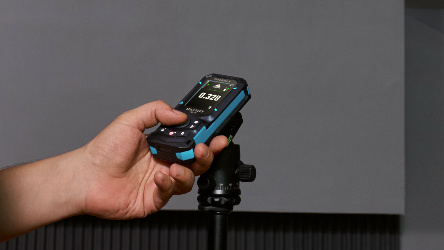 MILESEEY S50 green laser measure mounted on a tripod for precise measurement